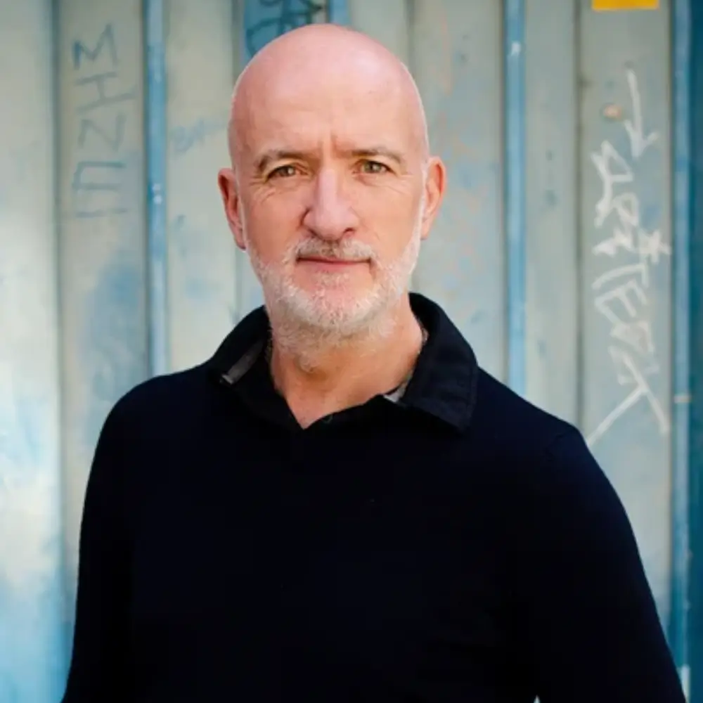 A bald man with a beard and mustache