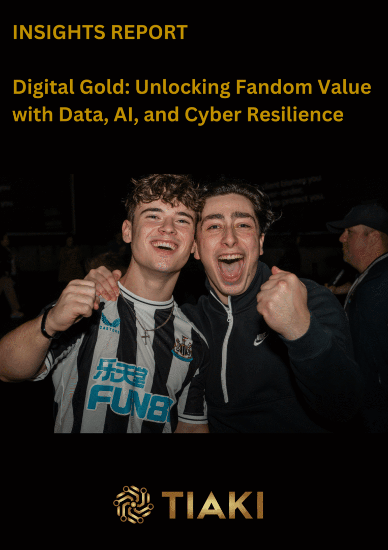 Two excited fans celebrating together, smiling.