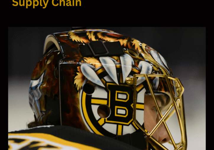 Goalie wearing a decorated helmet during game.