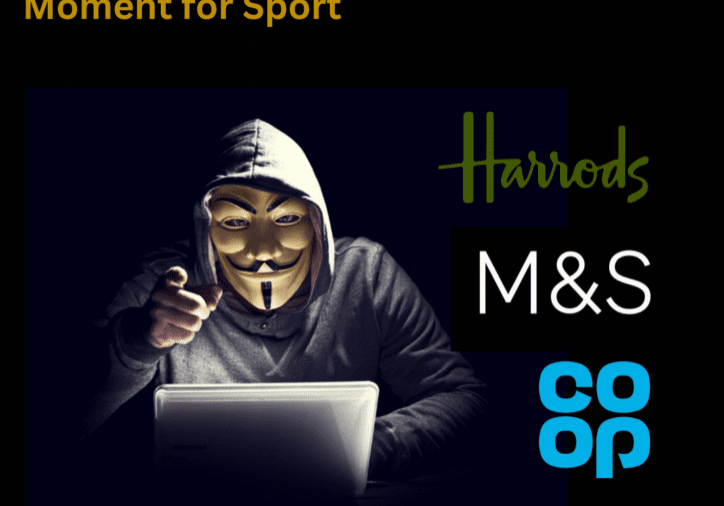 Hacker in mask with laptop, retail logos.